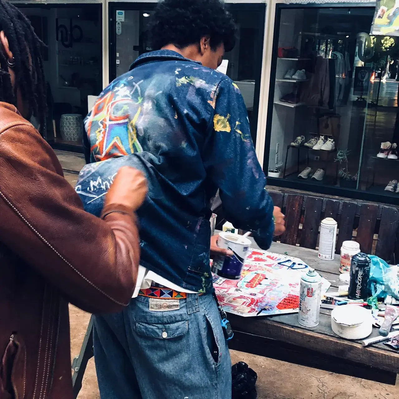 Artist painting jacket live at event
