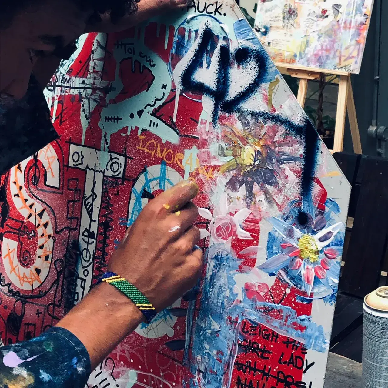 Artist painting the stop sign close-up